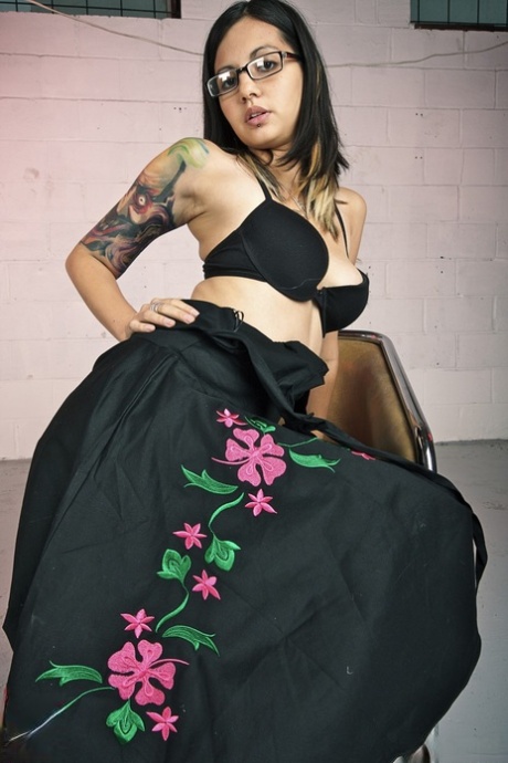 Glasses clad Holly D with big breasts drops dress & sheer panties to pose natural