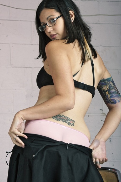 Glasses clad Holly D with big breasts drops dress & sheer panties to pose natural