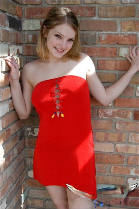 Young white girl Danielle reveals black upskirt panties outdoors