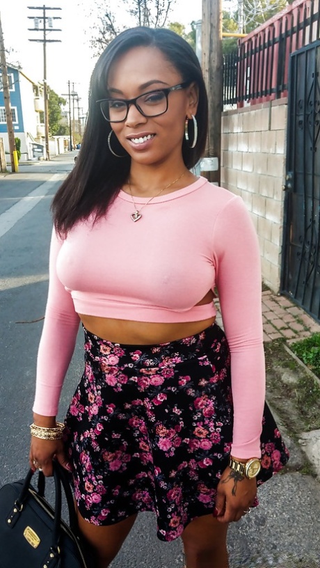 Busty ebony chick Porsha Carrera showing off her thong panties and phat curves