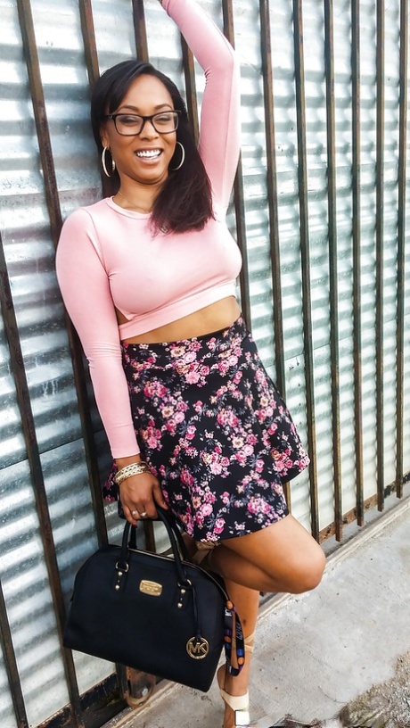 Busty ebony chick Porsha Carrera showing off her thong panties and phat curves