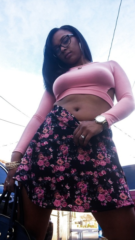 Busty ebony chick Porsha Carrera showing off her thong panties and phat curves