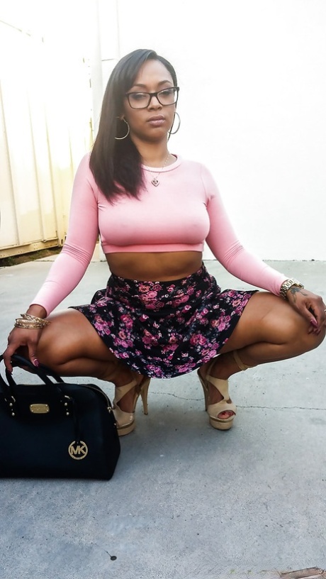 Busty ebony chick Porsha Carrera showing off her thong panties and phat curves