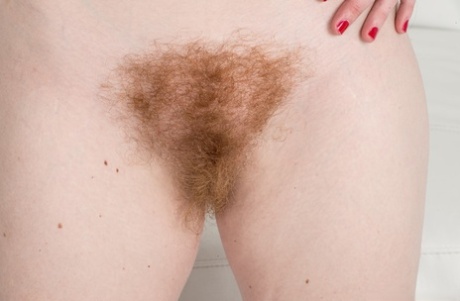 All natural Ana Molly drops her denim shorts to pet her hairy beaver