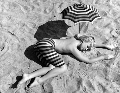 Mature Playboy goddess Sally Todd shows her slender body in different outfits