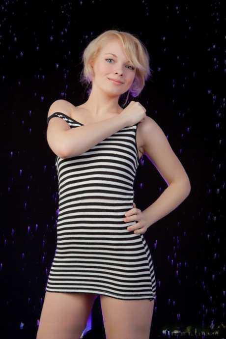 Smiley faced young adult Feeona A revealing toned body parts in the artistic