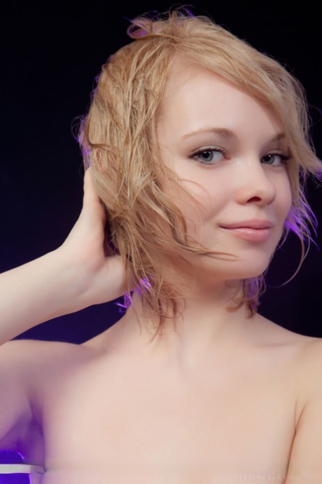 Smiley faced young adult Feeona A revealing toned body parts in the artistic