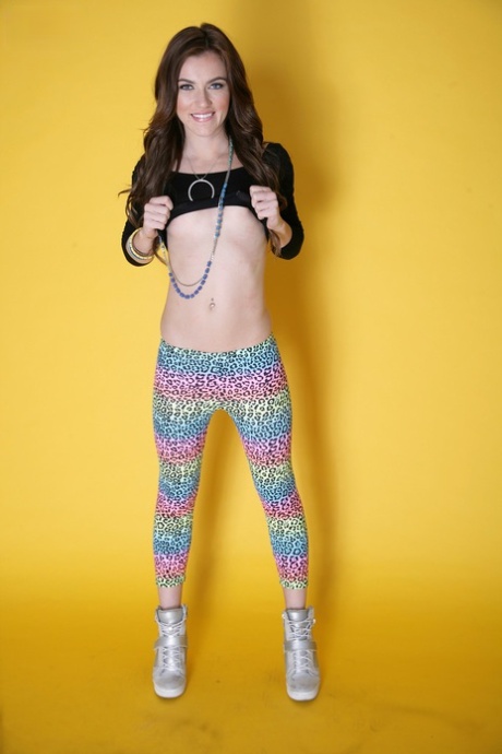 Likable girl Emma Stoned in leggings lets man take pictures of tiny titties