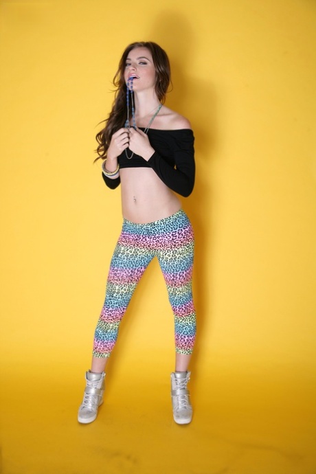 Likable girl Emma Stoned in leggings lets man take pictures of tiny titties