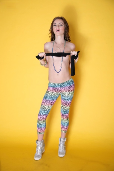 Likable girl Emma Stoned in leggings lets man take pictures of tiny titties