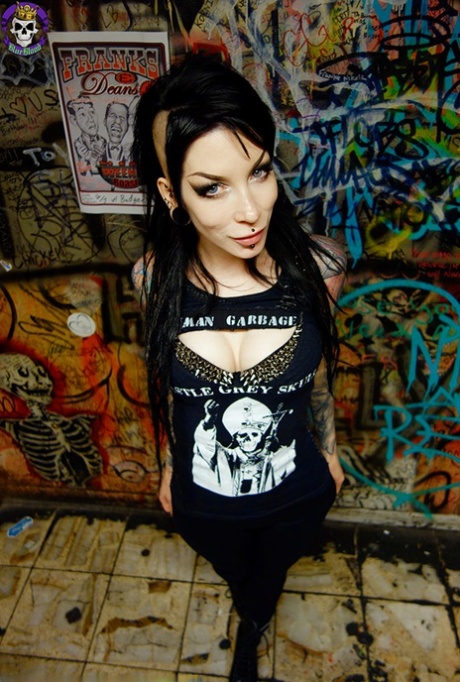 Goth girl Razor Candi strips to OTK boots in graffiti filled bathroom