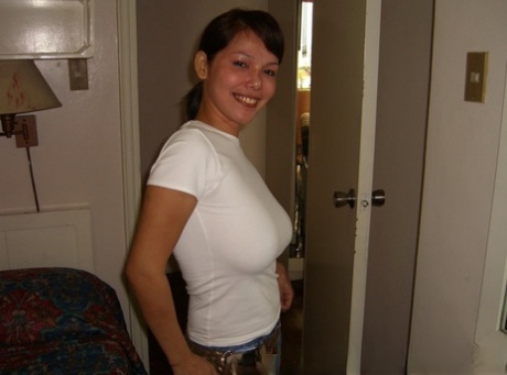 Filipina first timer cups her big naturals after undressing on a bed