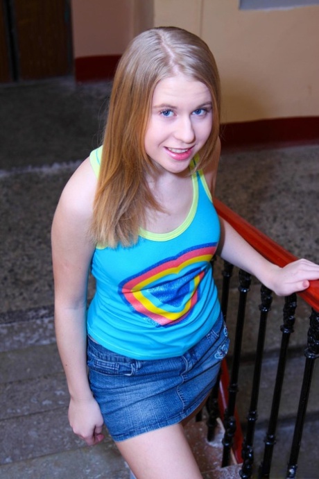 Tiny white girl Corinne B fingers her smooth femininity in knee socks