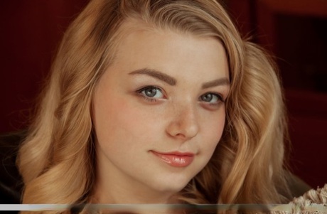 Young solo girl Daniel Sea uncovers her nice breasts and shaved femininity