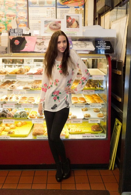 Naughty skinny chick Belle Knox flashes breasts and curves in the local store