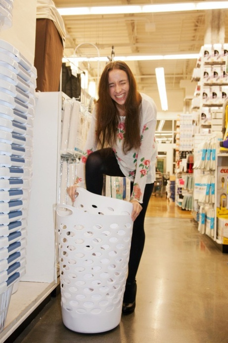 Naughty skinny chick Belle Knox flashes breasts and curves in the local store