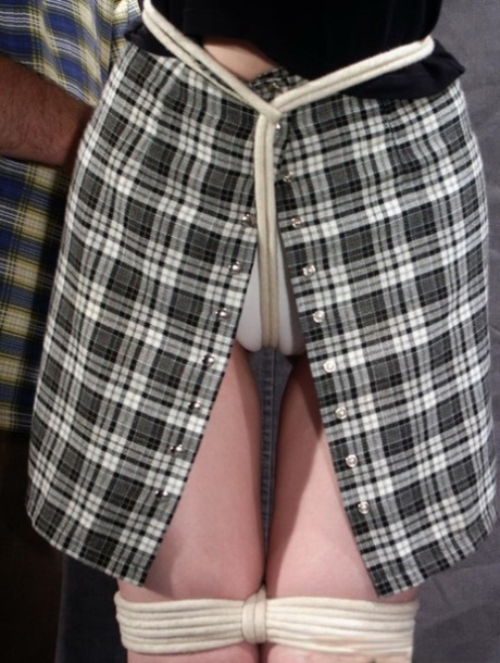 Restrained blonde girl is forced into having to smoke a cigarette