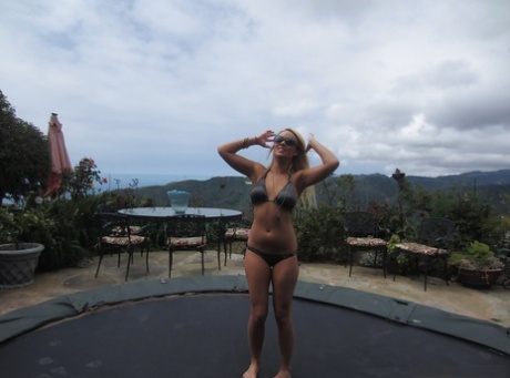 Curvy young adult blonde with big jugs Alexis Monroe slipping off her bikini