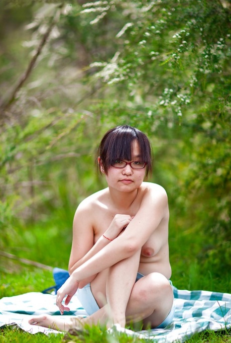 Hairy Asian authentic Gita slowly taking off her clothes outdoors