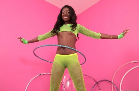 Slim black girl Anne Amari exposes her tiny titties and yummy curves in a solo