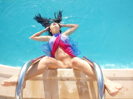 Amazingly alluring brunette authentic with long legs have some artistic pool fun