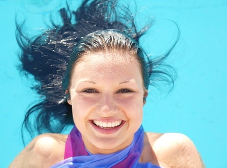 Amazingly alluring brunette authentic with long legs have some artistic pool fun