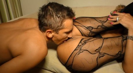 Busty mature Lana Vegas in crotchless pantyhose seduces younger guy for facial