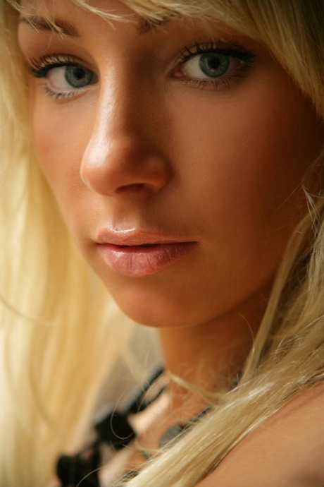 Super alluring young adult Dasha displaying her small breasts and attractive curves in the window