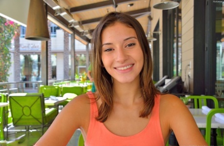 Adorable skinny young adult Roxanna flashes her trimmed vagina in public