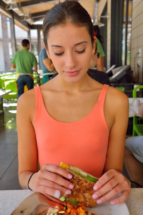 Adorable skinny young adult Roxanna flashes her trimmed vagina in public