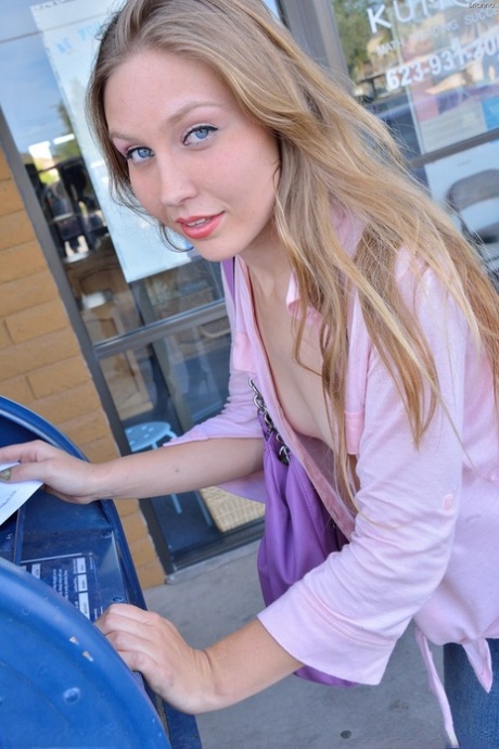 Gorgeous blonde filly with blue eyes enjoys stretching her tight cunt