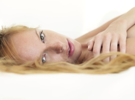 Alluring young adult with strawberry blonde hair Tubbea strikes great solo poses