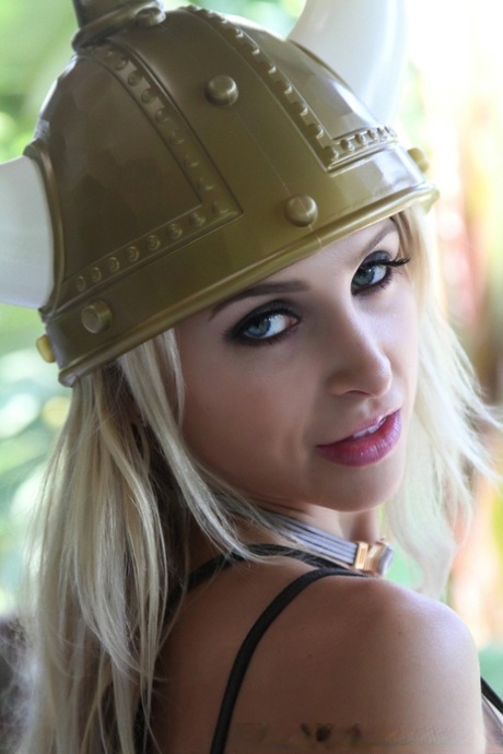 Blonde chick Alix Lynx unleashes her big breasts attired in a Viking outfit