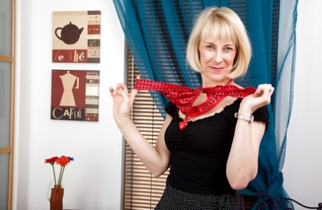 Seductive mature lady in stockings Hazel exposing her hairy cunt