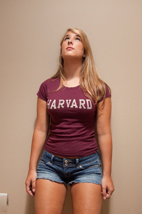 Athletic young adult Nicole Carver shows off toned body and attractive round curves at home.