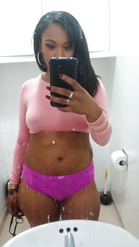 Curvy black chick Porsha Carrera taking selfies of her big black breasts