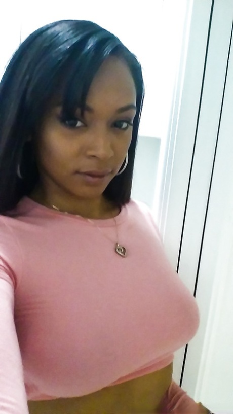 Curvy black chick Porsha Carrera taking selfies of her big black breasts