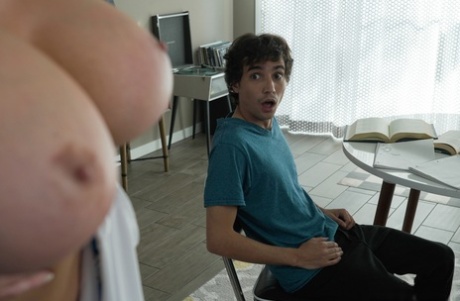 Curvy blonde Eva Notty shows her big butt during intimacy with a young boy