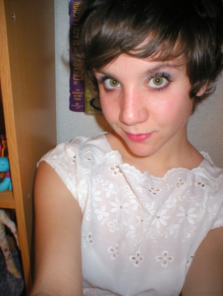 Pretty short-haired schoolgirl surprises with artistic pics taken by herself