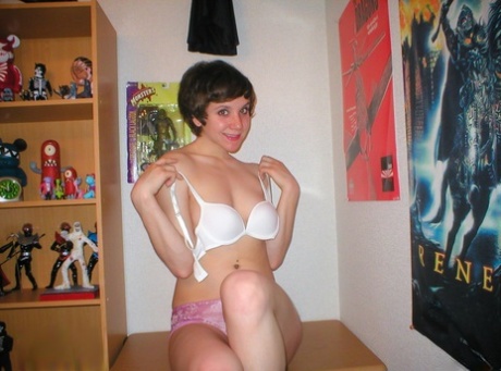 Pretty short-haired schoolgirl surprises with artistic pics taken by herself