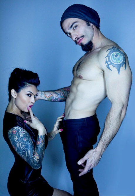 Tattooed alluring pornstar Asian showing big breasts in sheer lingerie