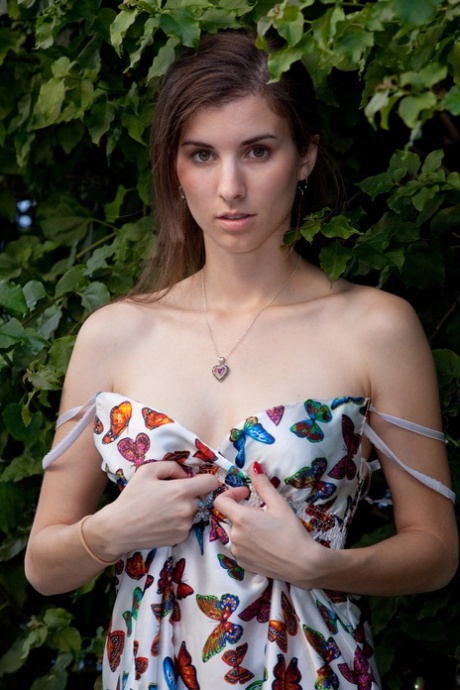 Adorable authentic young adult Melissa Johnston removes her dress and poses in undies