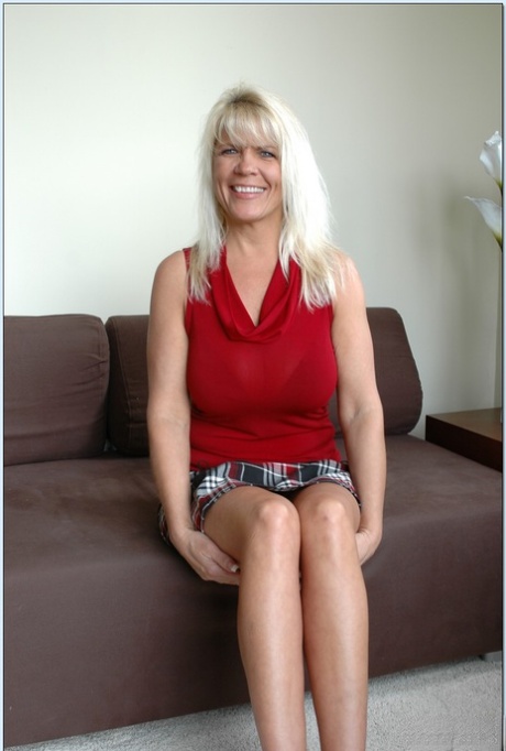 Blonde granny with amazing big breasts Jerrika Michaels rides a manhood on a couch