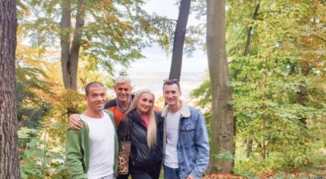 Blonde young adult Lovita Fate participates in MMF intimacy with older guys