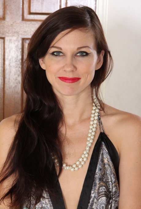 Slim female over 30 wiggles free of her dress and panties to pose artistic