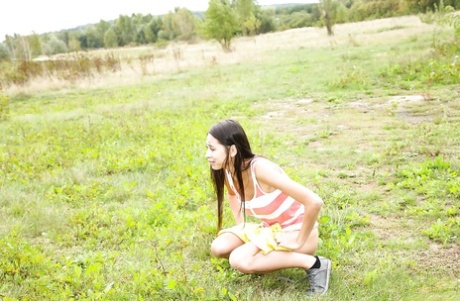 Barely legal young adult hottie flashing perfect big natural breasts outdoors