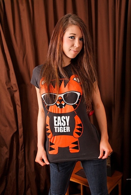 Slippy young adult in jeans getting natural and spreading her soft femininity lips