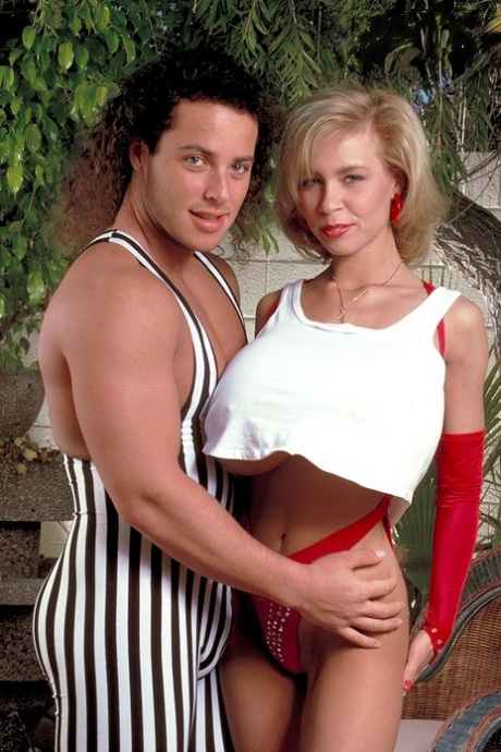 Famous pornstar Tiffany Towers has her monster breasts exposed by her man