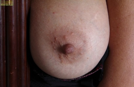 Busty mature lady Cally Jo getting natural and demonstrating her pink hole