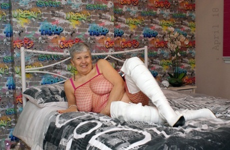 Bold granny Savana in thigh poses in fishnet body stocking & thigh high boots